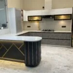 Real installed navy and gold modular kitchen island